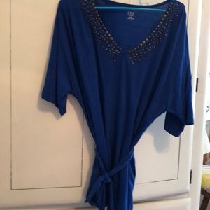 Top with brass beads around collar